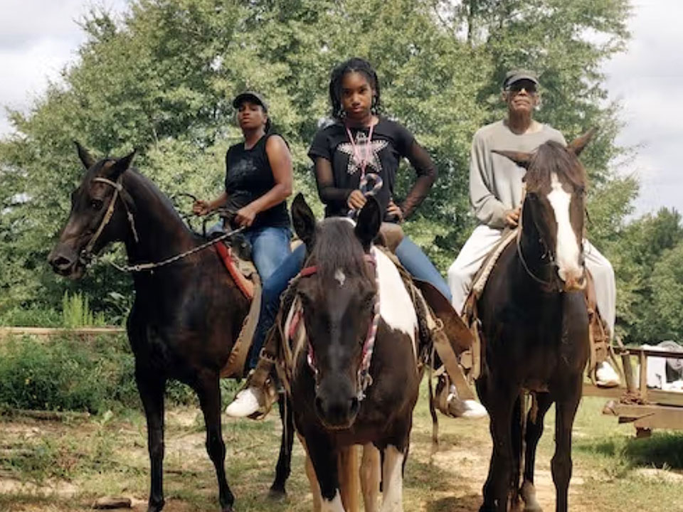 LaToya Ruby Frazier. Zion, Her Mother Shea, and Her Grandfather Mr. Smiley Riding on Their Tennessee Walking Horses
